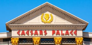 Caesars enjoys big digital gains as it holds back from prediction markets A close-up view of the front of Caesars Palace casino in Las Vegas