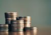 Coins as Coinbase faces a lawsuit in Nevada over event contracts.