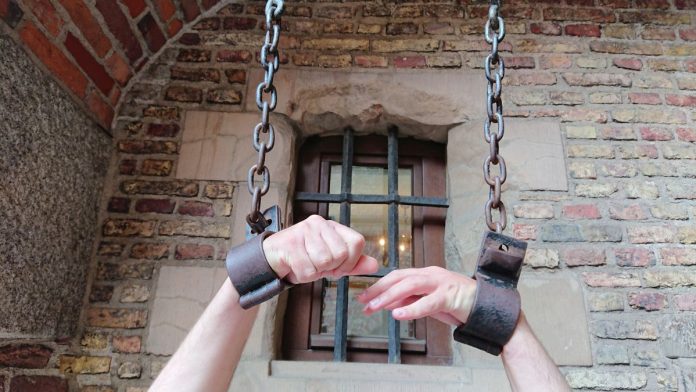 Dina-Titus'-federal-bill-latest-legislative-effort-to-shackle-prediction-markets A person's arms in shackles