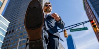 Genius Sports steps into gaming media space with $1.2B Legend deal View from underneath of a businessman taking a stride forward