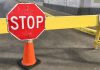 Illinois gaming committee chair attempting to repeal per-wager tax A stop sign on a road barrier in Chicago, Illinois