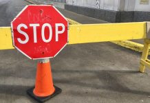 A stop sign on a road barrier in Chicago, Illinois