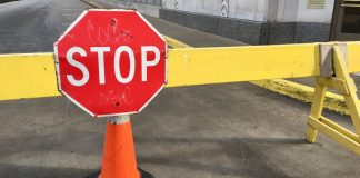 Illinois gaming committee chair attempting to repeal per-wager tax A stop sign on a road barrier in Chicago, Illinois