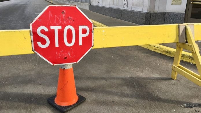 A stop sign on a road barrier in Chicago, Illinois
