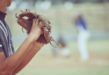 A baseball pitcher as ESPN reports a bigger gambling scheme for MLB pitcher Emmanuel Clase.