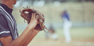 A baseball pitcher as ESPN reports a bigger gambling scheme for MLB pitcher Emmanuel Clase.