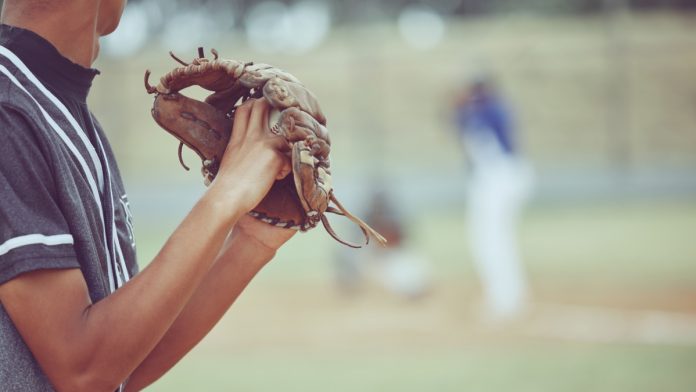 A baseball pitcher as ESPN reports a bigger gambling scheme for MLB pitcher Emmanuel Clase.