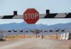 Nevada judge temporarily bans Polymarket contracts in state A stop sign with a barrier on a road in Nevada