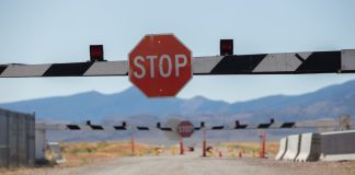 Nevada judge temporarily bans Polymarket contracts in state A stop sign with a barrier on a road in Nevada