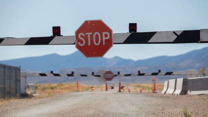 Nevada-judge-temporarily-bans-Polymarket-contracts-in-state A stop sign with a barrier on a road in Nevada