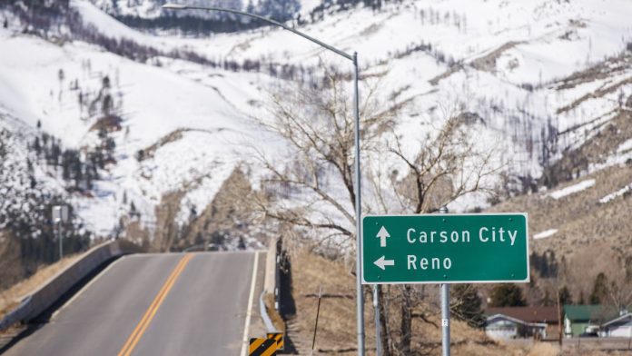 Nevada-regulator-goes-on-offensive-against-Kalshi-in-state-court A road sign pointing towards the Nevada capital, Carson City