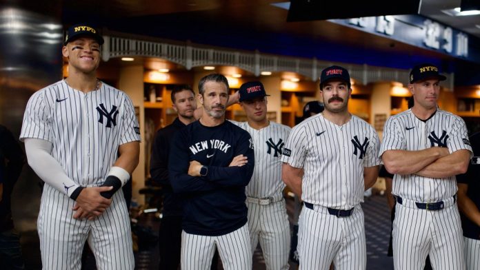 New-York-regulator-will-consider-banning-some-bets,-calls-on-leagues Aaron Judge and other New York Yankees players and staff in the locker room