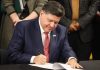 Pritzker budget aims to overhaul Illinois’ casino table game tax rate Illinois Gov. JB Pritzker signs a document as he aims to make tax changes for casino gaming.