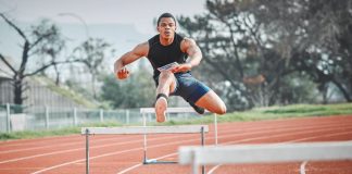 Virginia online casino & sweepstakes bill vaults committee hurdles A male runner jumping hurdles on a track