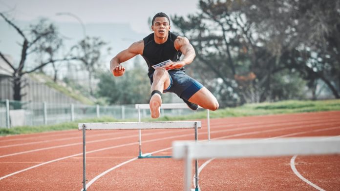 Virginia-online-casino-and-sweepstakes-bill-vaults-committee-hurdles A male runner jumping hurdles on a track