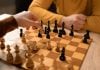 Arizona AG responds with first criminal lawsuit against Kalshi Two people playing a game of chess