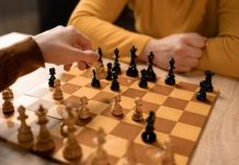 Two people playing a game of chess