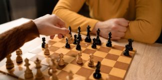 Two people playing a game of chess