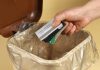 BetMGM latest US operator to ban credit card funding A person throwing credit cards into a trash can
