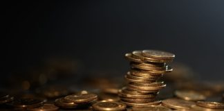 Coins as Coinbase faces legal proceedings in Nevada.