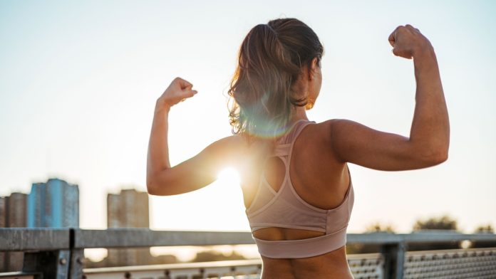 A woman flexing as DraftKings debuts a new Flex Spin feature for online casino players.