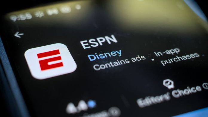 The ESPN app downloading on a phon