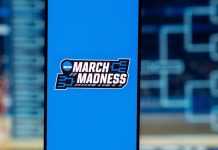DraftKings claims fair March Madness usage after NCAA sues The trademarked March Madness phrase and logo on a phone screen