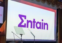 The Entain logo on a screen at an SBC Awards ceremony