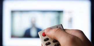 A person turning the TV off as FanDuel TV is set to shutter.