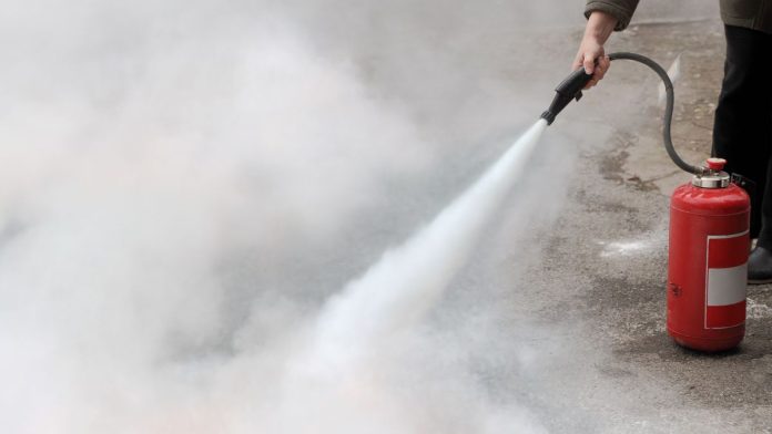 Georgia-sports-betting-efforts-extinguished-in-state-House A person using a fire extinguisher