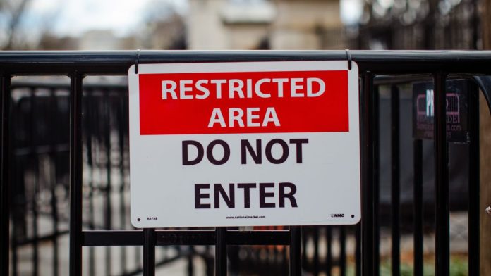 Indiana-formally-bans-sweepstakes-casinos-as-Gov.-Braun-signs-bill A "restricted area" sign on a gate