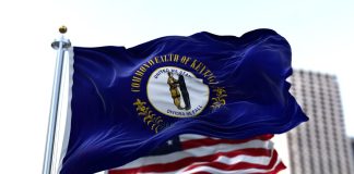 The Kentucky and the USA flags flying