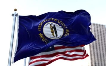 The Kentucky and the USA flags flying