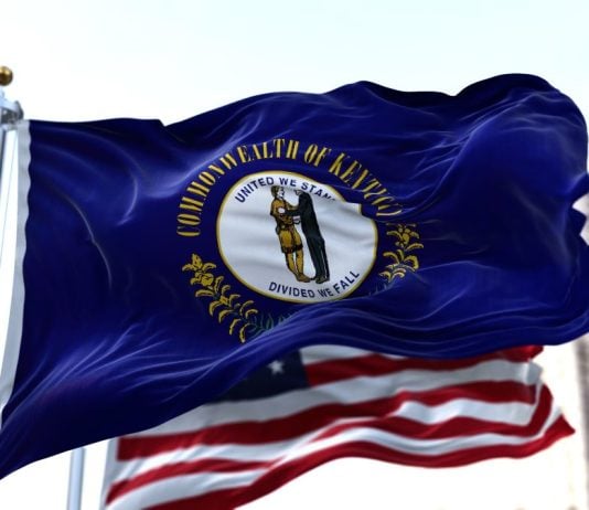 The Kentucky and the USA flags flying