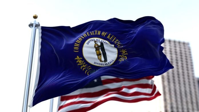 The Kentucky and the USA flags flying