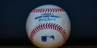 A baseball as MLB secures partnerships with Polymarket and the CFTC.