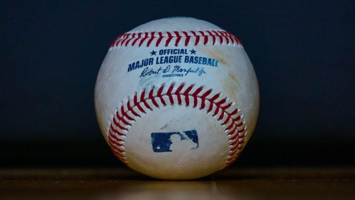A baseball as MLB secures partnerships with Polymarket and the CFTC.