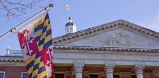 The Maryland flag flies outside the state house