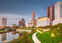 Columbus, Ohio skyline on the river at dusk.