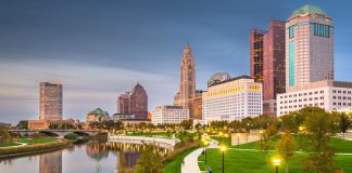Columbus, Ohio skyline on the river at dusk.