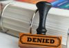 Denied stamp as Polymarket is denied a temporary restraining order in Michigan.