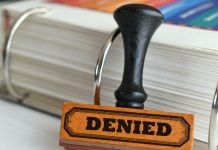 Denied stamp as Polymarket is denied a temporary restraining order in Michigan.