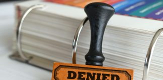 Denied stamp as Polymarket is denied a temporary restraining order in Michigan.