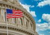The US flag flying in front of Congress