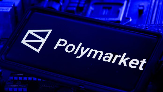 Predictions-Market-Weekly-Kalshi-takes-hits-Argentina-bans-Polymarket The Polymarket logo on a phone