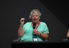 Sue Schneider speaking on stage