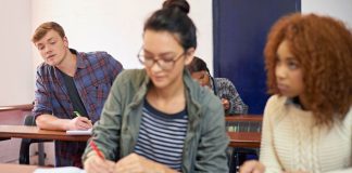 A student copying another student's work during a test
