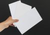CFTC sues AZ, CT, and IL, alleging prediction markets overstep A person holding three white envelopes