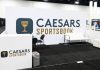 A Caesars Sportsbook booth at an SBC event
