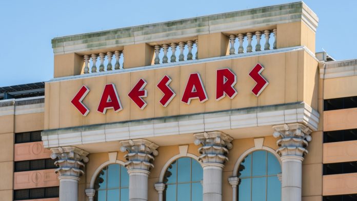 Caesars-Entertainment-Extend-Talks-Tilman-Fertitta Caesars sign as the company extends talks with Tilman Fertitta.